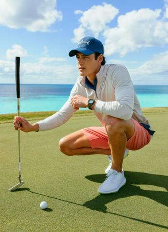 A lifestyle image from Southern Tide showing a man golfing