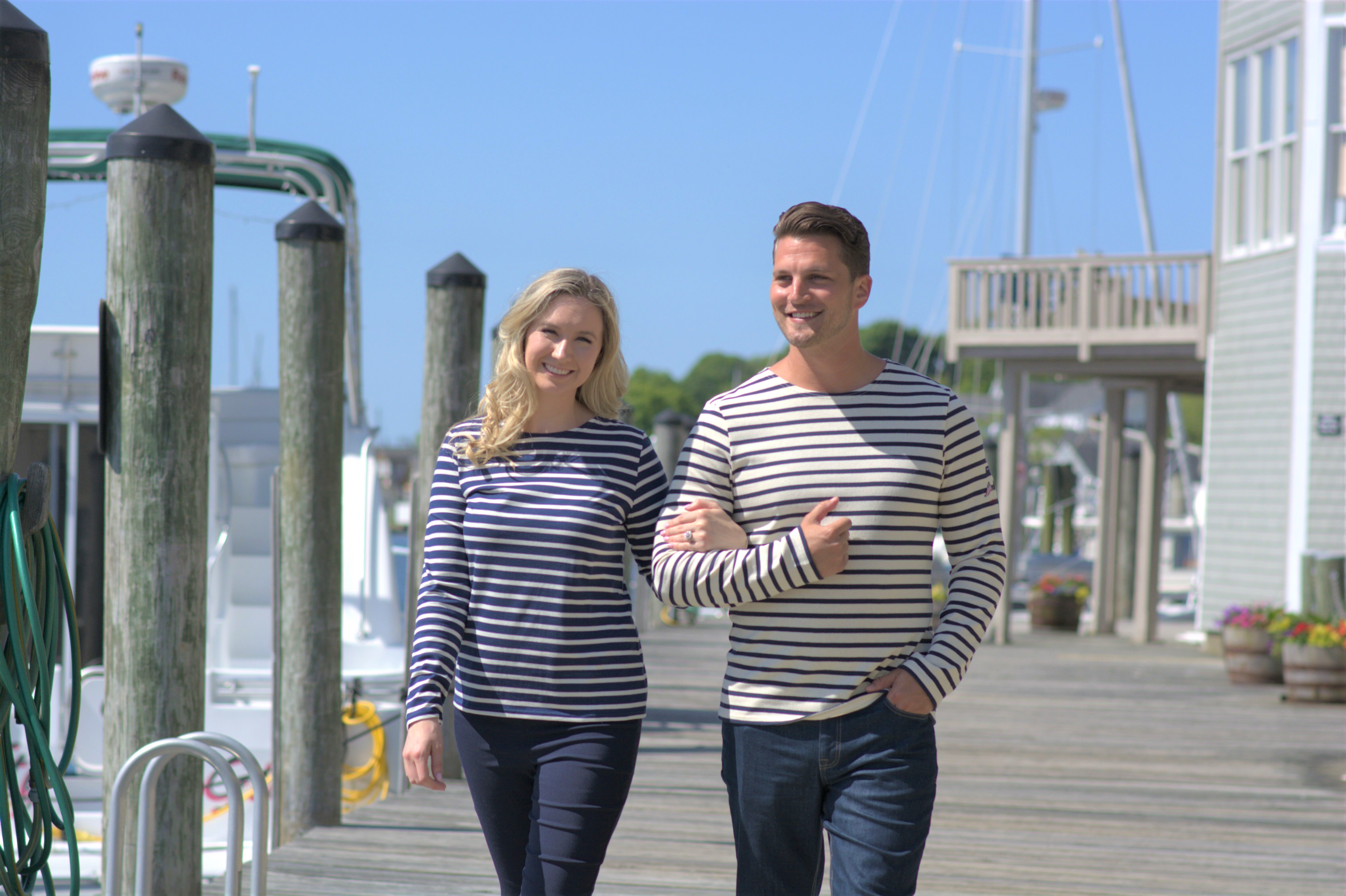 Image of a man and a woman wearing classic Breton stripe tops from Saint-James